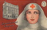 A White female Red Cross nurse, visible from the head up, in front of a picture of a hospital.