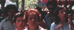 Still of a group of people walking down the street